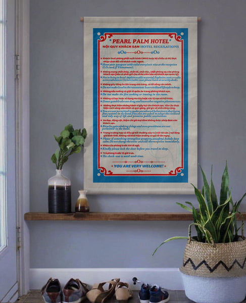 A Vietnamese hotels rules and regulations printed on canvas fabric, hanging on a wall in a interior hallway, with a variety of rules and regulations in both Vietnamese and English translations.